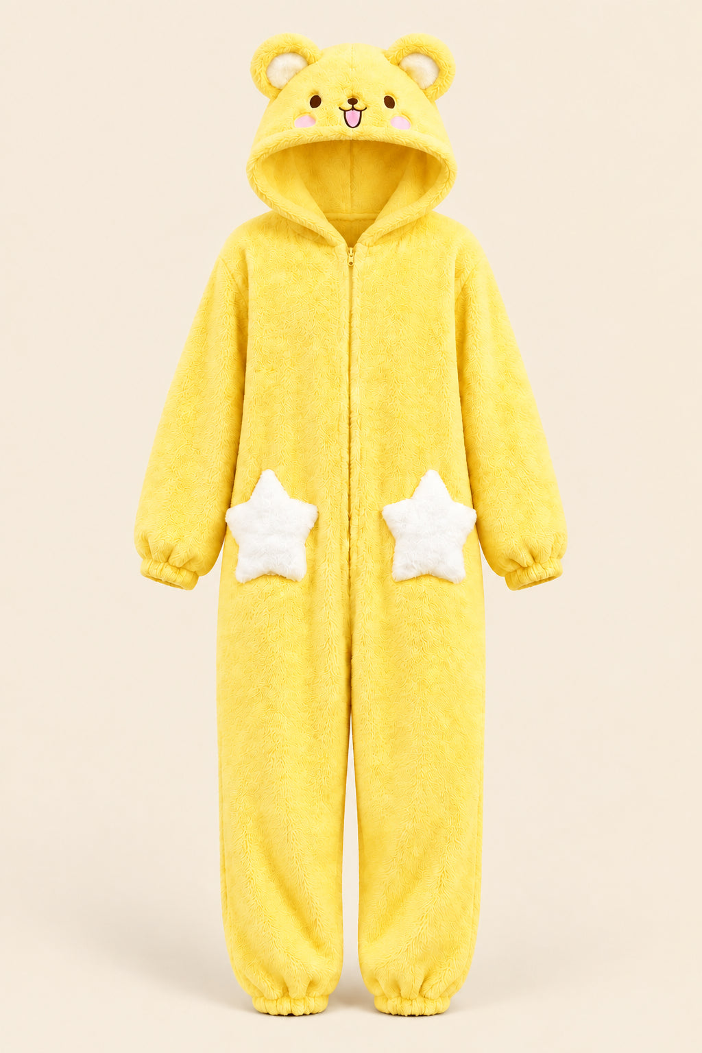 A person wearing a fluffy yellow bear-themed hooded onesie with white star patches on the legs, taking a mirror selfie in a bedroom setting.