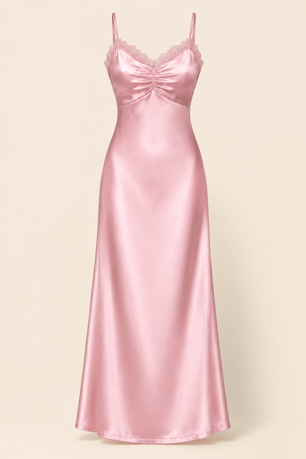 A light pink satin slip gown with thin spaghetti straps, a gathered sweetheart neckline, and a scalloped lace trim at the neckline, shown against a solid beige background.