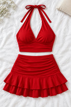 A woman modeling a bright red two-piece halter crop top and matching ruffled mini skirt, shown in front and back views. The image has a pink 'Divi shop' logo at the top and contact details at the bottom.
