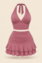 A woman modeling a dusty rose halter crop top and matching ruffled mini skirt, shown in front and back views side by side. The image includes a 'Diaa shop' logo at the top, a phone number at the bottom left, and a code at the bottom right.