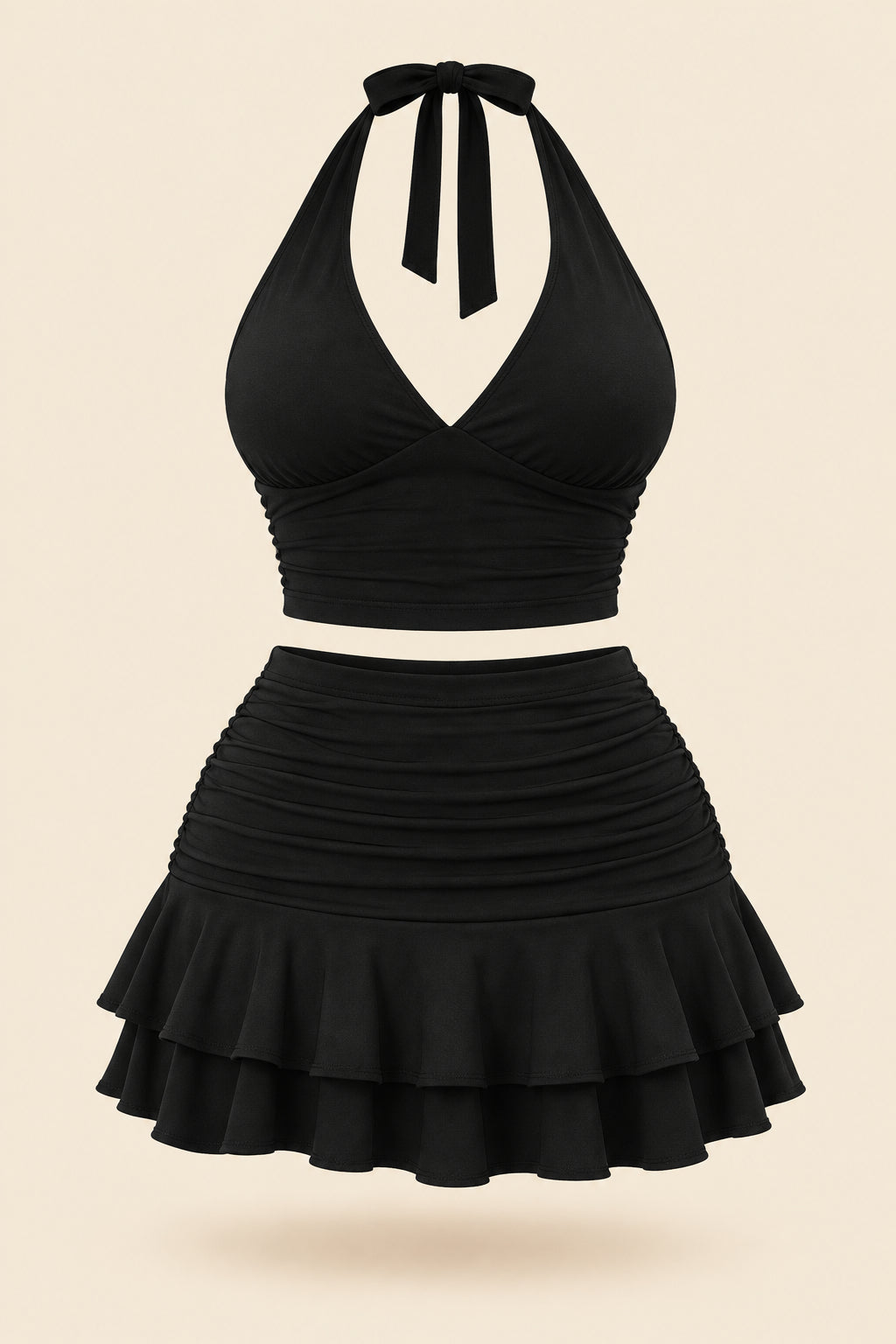 A woman modeling a black two-piece outfit consisting of a halter crop top and a ruched ruffled mini skirt, shown in front and back views side by side. The image has a pink 'Diva shop' logo at the top and contact details at the bottom.