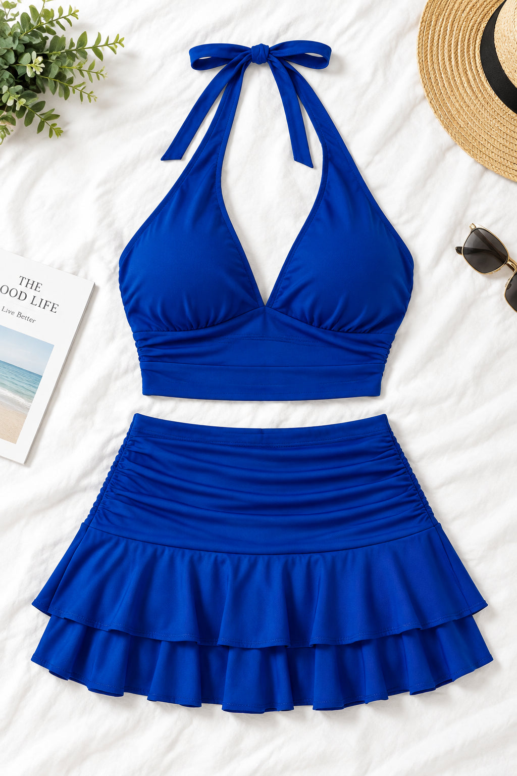 A woman modeling a royal blue two-piece halter set with a deep V-neck crop top and a ruffled mini skirt, shown in front and back views on a split background. A pink 'Diaou shop' logo is visible at the top, with contact details and 'Code:0120' at the bottom.
