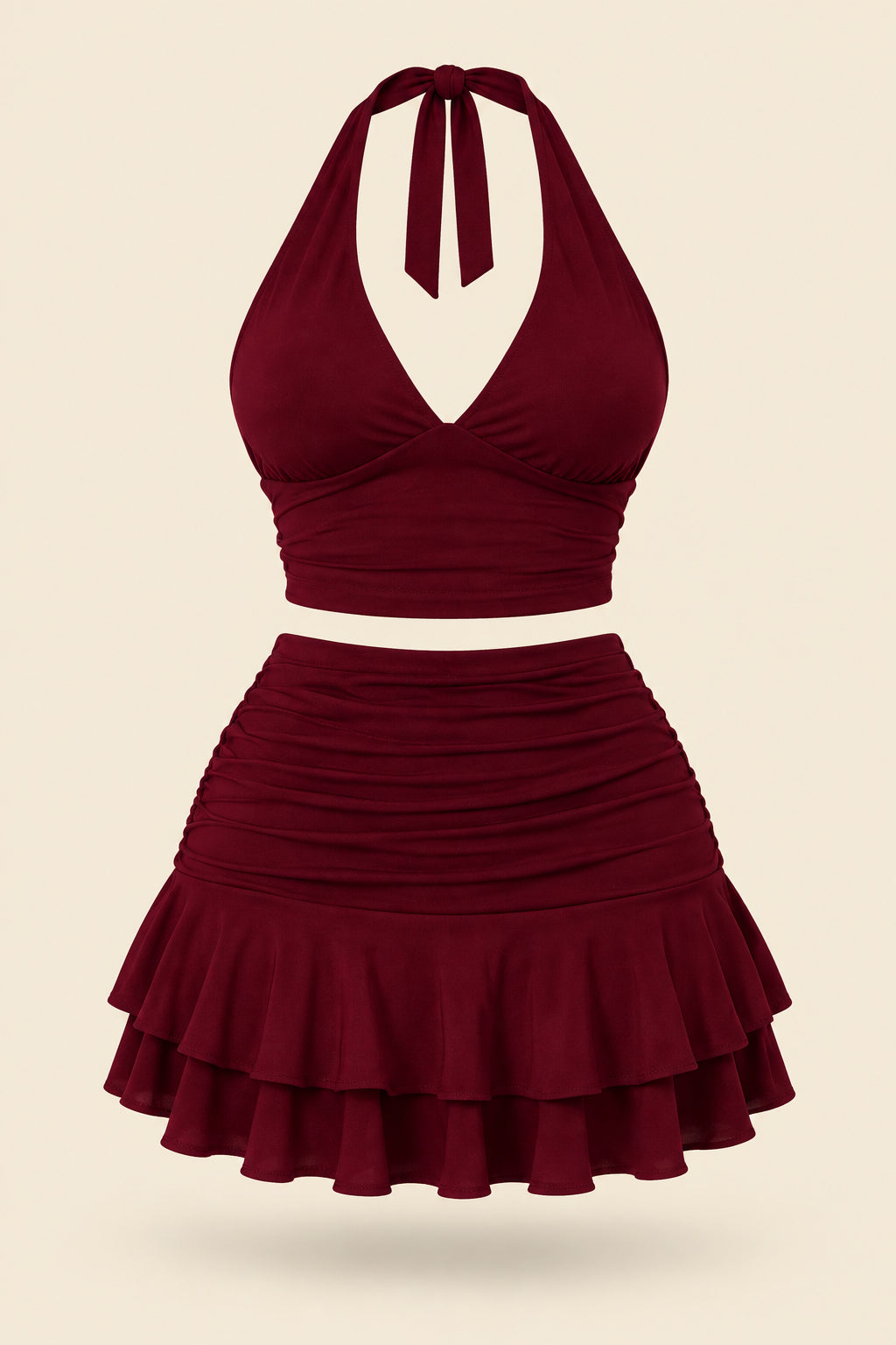 A woman modeling a two-piece burgundy halter crop top and matching ruffled mini skirt, shown in front and back views on a split-screen background. A pink 'Diaa shop' logo appears at the top, with a phone number and code text at the bottom.