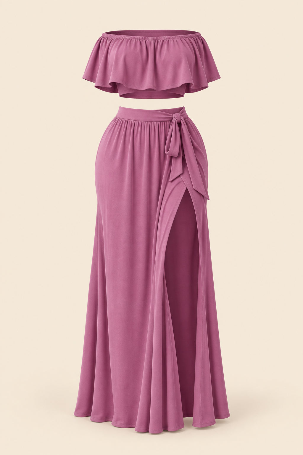A woman modeling a mauve two-piece lingerie set in a furnished indoor room, with a smaller inset view showing the back of the set. The set includes a strapless ruffled crop top and a high-slit maxi skirt.