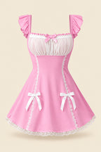 A woman modeling a pink lingerie chemise with white lace trim and bow details, shown in a bedroom setting with promotional text overlays and a small inset back view.