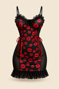 A woman models a black mini dress with red lip print and sheer mesh panels in a warmly lit bedroom setting. Two smaller inset views on the right show the dress from different angles, and text overlays include 'JOY ENA Lingerie', 'Size Free Size Model 1342', and promotional copy.