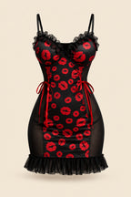 A woman models a black mini dress with red lip print and sheer mesh panels in a warmly lit bedroom setting. Two smaller inset views on the right show the dress from different angles, and text overlays include 'JOY ENA Lingerie', 'Size Free Size Model 1342', and promotional copy.